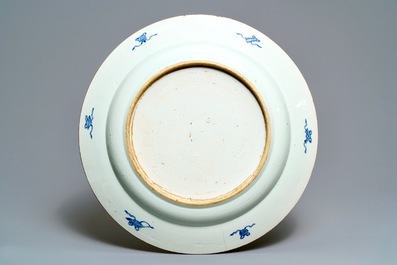 A large Chinese blue and white 'peacock border' dish, Kangxi